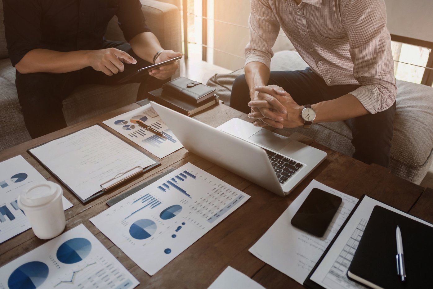 Business executives analyzing on valuation data paper